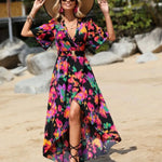 Women's tropical neon floral high-low wrap dress with flutter sleeves, V-neckline, and belted waist – lightweight chiffon vacation maxi.