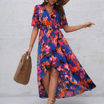 Women's tropical neon floral high-low wrap dress with flutter sleeves, V-neckline, and belted waist – lightweight chiffon vacation maxi.