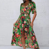 Women's tropical neon floral high-low wrap dress with flutter sleeves, V-neckline, and belted waist – lightweight chiffon vacation maxi.