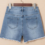Women's high-waisted denim shorts with faux pearl embellishments and frayed hem – trendy summer jean shorts for casual and chic outfits.
