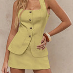 Women's sleeveless blazer mini dress with square neckline, vintage gold buttons, and front pockets – tailored vest-style dress available in multiple colors.