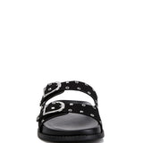 Women’s nubuck faux leather slide sandals with silver buckle straps, metal eyelet embellishments, and flat black soles in olive green and black color options.