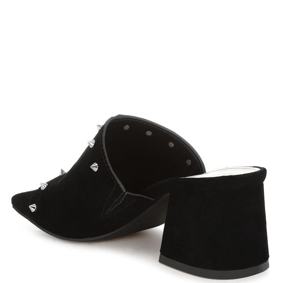 Black microsuede open-toe mule with silver cone studs and mid block heel, shown from multiple angles against white background.