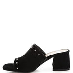 Black microsuede open-toe mule with silver cone studs and mid block heel, shown from multiple angles against white background.