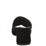 Black microsuede open-toe mule with silver cone studs and mid block heel, shown from multiple angles against white background.