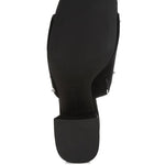 Black microsuede open-toe mule with silver cone studs and mid block heel, shown from multiple angles against white background.