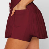 Women's wine red ruffle athletic skort with high-waist drawstring waistband and built-in shorts – moisture-wicking tennis skirt.