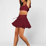 Women's wine red ruffle athletic skort with high-waist drawstring waistband and built-in shorts – moisture-wicking tennis skirt.
