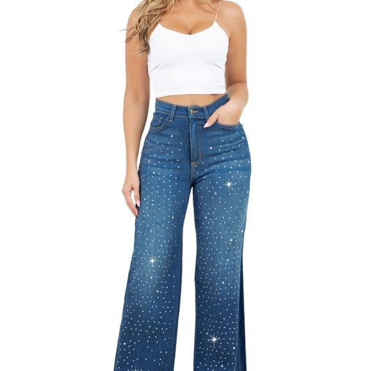 Woman modeling high-rise wide-leg blue “Starlight Rhinestone” jeans, denim sprinkled with sparkling crystal studs and star-dot back pockets.
