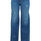 Woman modeling high-rise wide-leg blue “Starlight Rhinestone” jeans, denim sprinkled with sparkling crystal studs and star-dot back pockets.