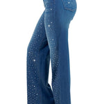 Woman modeling high-rise wide-leg blue “Starlight Rhinestone” jeans, denim sprinkled with sparkling crystal studs and star-dot back pockets.