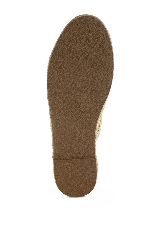 Backless women’s espadrille mule with woven raffia upper and jute sole, shown in yellow, black, and natural beige color options.