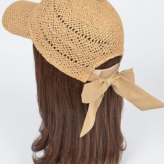 Women’s woven straw baseball cap with curved visor, breathable crochet crown, and adjustable tan bow-back tie, shown from multiple angles.