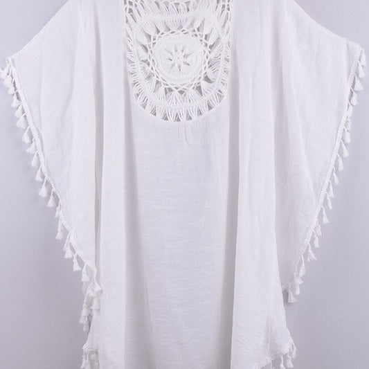 Women’s boho crochet-medallion beach cover-up poncho with tassel trim in lightweight cotton gauze, shown in White.