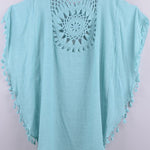 Women’s boho crochet-medallion beach cover-up poncho with tassel trim in lightweight cotton gauze, shown in Light Blue.