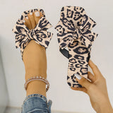 Women's leopard print bow slide sandals with square toe – stylish slip-on flat summer shoes for casual wear, featuring oversized knot bow detail.