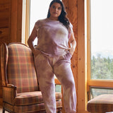 Introducing the Curvy Line- Lavender Tie-dye Relaxed Top &amp; High Waist Jogger Pants Set. This fashionable set features a unique tie-dye design in a soothing lavender color. The relaxed top and high waist jogger pants offer both style and comfort, making it a must-have for any fashion-forward individual. Perfect for any occasion, this set is sure to make a statement.