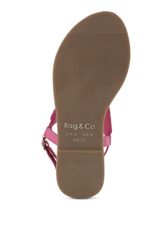 Pink, black and beige flat sandals with Aztec-style hand-beaded T-strap uppers, adjustable ankle buckle and cushioned footbed, boho summer women’s footwear.