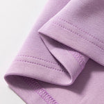 Short Sleeve Zipper Collared Elastic High Waist Romper in pink up close of the hem
