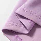 Short Sleeve Zipper Collared Elastic High Waist Romper in pink up close of the hem