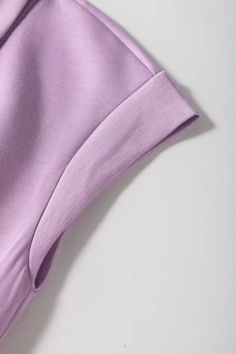 Short Sleeve Zipper Collared Elastic High Waist Romper in pink up close of the sleeve