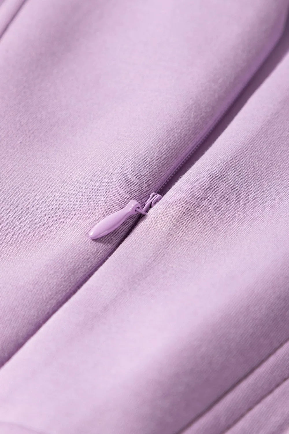 Short Sleeve Zipper Collared Elastic High Waist Romper in pink up close of the zipper