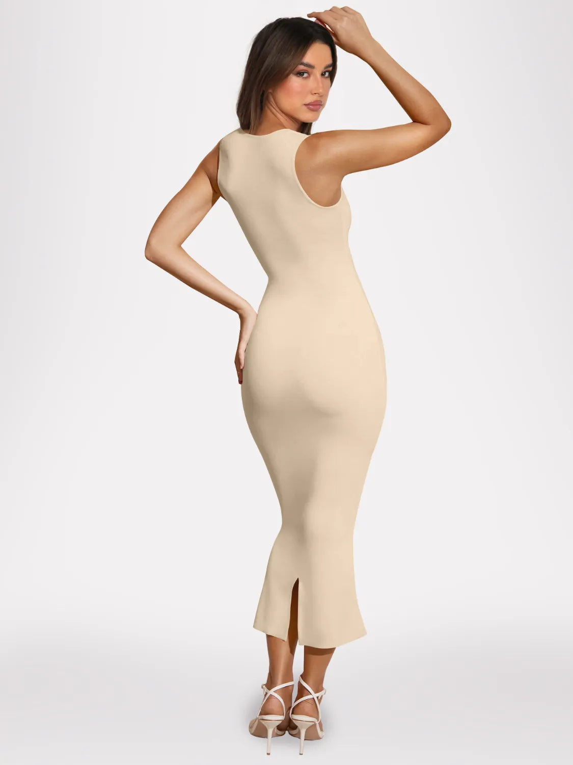 Women's beige nude square-neck bodycon midi dress with smooth ribbed fabric and subtle flared hem.