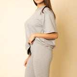 Women's oversized two-piece lounge set featuring a relaxed fit short-sleeve tee and high-waisted biker shorts, available in multiple vibrant colors. Perfect for casual wear, workouts, or athleisure style.