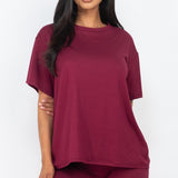 Women's oversized two-piece lounge set featuring a relaxed fit short-sleeve tee and high-waisted biker shorts, available in multiple vibrant colors. Perfect for casual wear, workouts, or athleisure style.