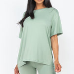 Women's oversized two-piece lounge set featuring a relaxed fit short-sleeve tee and high-waisted biker shorts, available in multiple vibrant colors. Perfect for casual wear, workouts, or athleisure style.