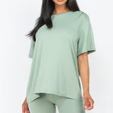 Women's oversized two-piece lounge set featuring a relaxed fit short-sleeve tee and high-waisted biker shorts, available in multiple vibrant colors. Perfect for casual wear, workouts, or athleisure style.