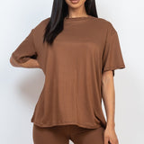 Women's oversized two-piece lounge set featuring a relaxed fit short-sleeve tee and high-waisted biker shorts, available in multiple vibrant colors. Perfect for casual wear, workouts, or athleisure style.
