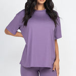 Women's oversized two-piece lounge set featuring a relaxed fit short-sleeve tee and high-waisted biker shorts, available in multiple vibrant colors. Perfect for casual wear, workouts, or athleisure style.