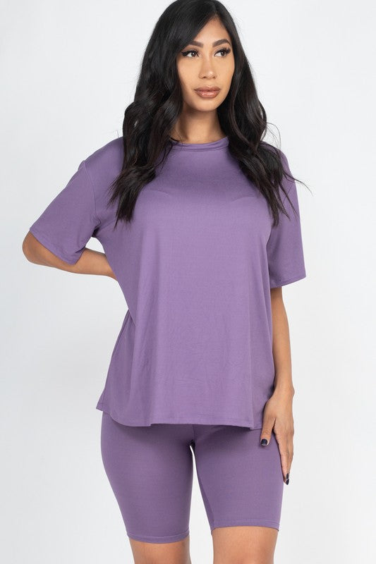 Women's oversized two-piece lounge set featuring a relaxed fit short-sleeve tee and high-waisted biker shorts, available in multiple vibrant colors. Perfect for casual wear, workouts, or athleisure style.