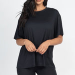 Women's oversized two-piece lounge set featuring a relaxed fit short-sleeve tee and high-waisted biker shorts, available in multiple vibrant colors. Perfect for casual wear, workouts, or athleisure style.