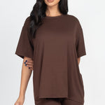 Women's oversized two-piece lounge set featuring a relaxed fit short-sleeve tee and high-waisted biker shorts, available in multiple vibrant colors. Perfect for casual wear, workouts, or athleisure style.