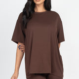 Women's oversized two-piece lounge set featuring a relaxed fit short-sleeve tee and high-waisted biker shorts, available in multiple vibrant colors. Perfect for casual wear, workouts, or athleisure style.