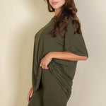 Women's oversized two-piece lounge set featuring a relaxed fit short-sleeve tee and high-waisted biker shorts, available in multiple vibrant colors. Perfect for casual wear, workouts, or athleisure style.