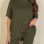 Women's oversized two-piece lounge set featuring a relaxed fit short-sleeve tee and high-waisted biker shorts, available in multiple vibrant colors. Perfect for casual wear, workouts, or athleisure style.