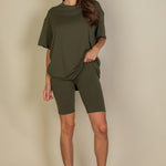 Women's oversized two-piece lounge set featuring a relaxed fit short-sleeve tee and high-waisted biker shorts, available in multiple vibrant colors. Perfect for casual wear, workouts, or athleisure style.