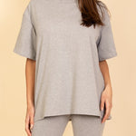 Women's oversized two-piece lounge set featuring a relaxed fit short-sleeve tee and high-waisted biker shorts, available in multiple vibrant colors. Perfect for casual wear, workouts, or athleisure style.