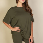 Women's oversized two-piece lounge set featuring a relaxed fit short-sleeve tee and high-waisted biker shorts, available in multiple vibrant colors. Perfect for casual wear, workouts, or athleisure style.