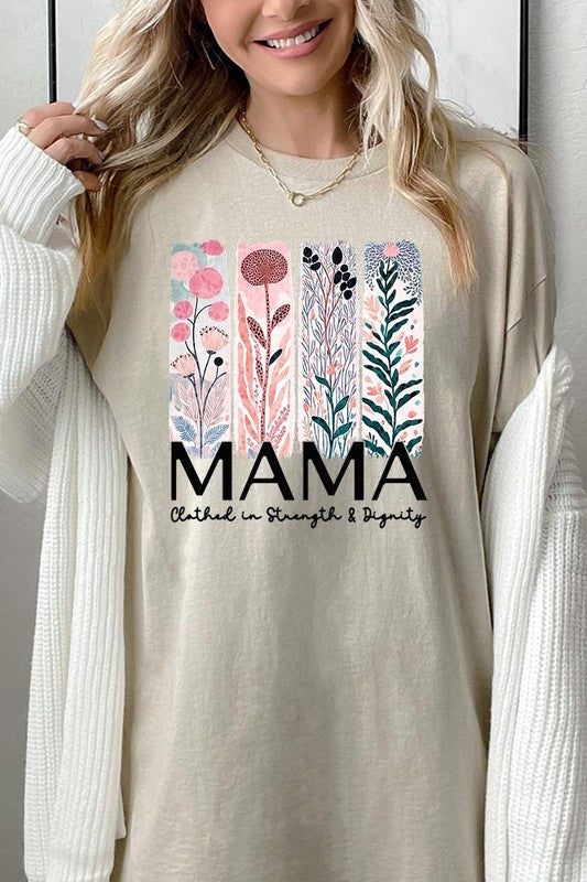 Cream-colored T-shirt with pastel pink and teal floral panel design and bold ‘MAMA’ graphic reading ‘Clothed in Strength & Dignity.