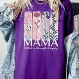 Purple T-shirt with pastel pink and teal floral panel design and bold ‘MAMA’ graphic reading ‘Clothed in Strength & Dignity.