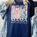 T-shirt with pastel pink and teal floral panel design and bold ‘MAMA’ graphic reading ‘Clothed in Strength & Dignity.