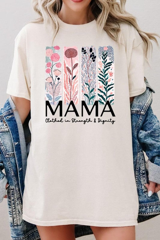 Cream-colored T-shirt with pastel pink and teal floral panel design and bold ‘MAMA’ graphic reading ‘Clothed in Strength & Dignity.