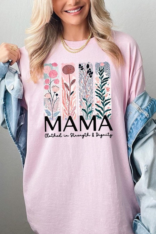Pink T-shirt with pastel pink and teal floral panel design and bold ‘MAMA’ graphic reading ‘Clothed in Strength & Dignity.