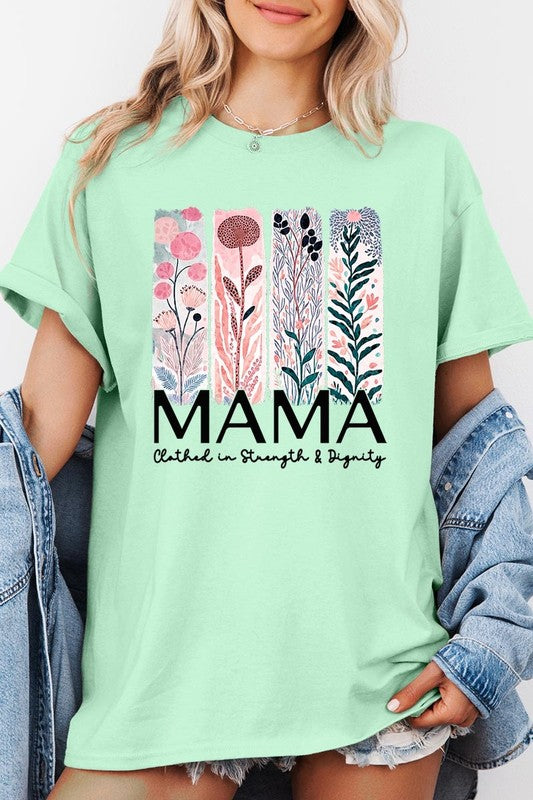 Green T-shirt with pastel pink and teal floral panel design and bold ‘MAMA’ graphic reading ‘Clothed in Strength & Dignity.