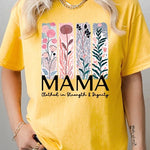 Yellow T-shirt with pastel pink and teal floral panel design and bold ‘MAMA’ graphic reading ‘Clothed in Strength & Dignity.