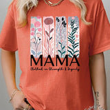 T-shirt with pastel pink and teal floral panel design and bold ‘MAMA’ graphic reading ‘Clothed in Strength & Dignity.